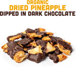 Healthy dark chocolate covered pineapple snack in a bowl