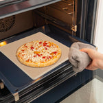 Garpernics pizza stone packaged with 50 parchment paper sheets