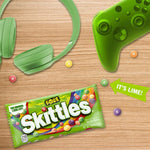 Skittles Sour candy pieces arranged by flavor including strawberry lemon and lime.
