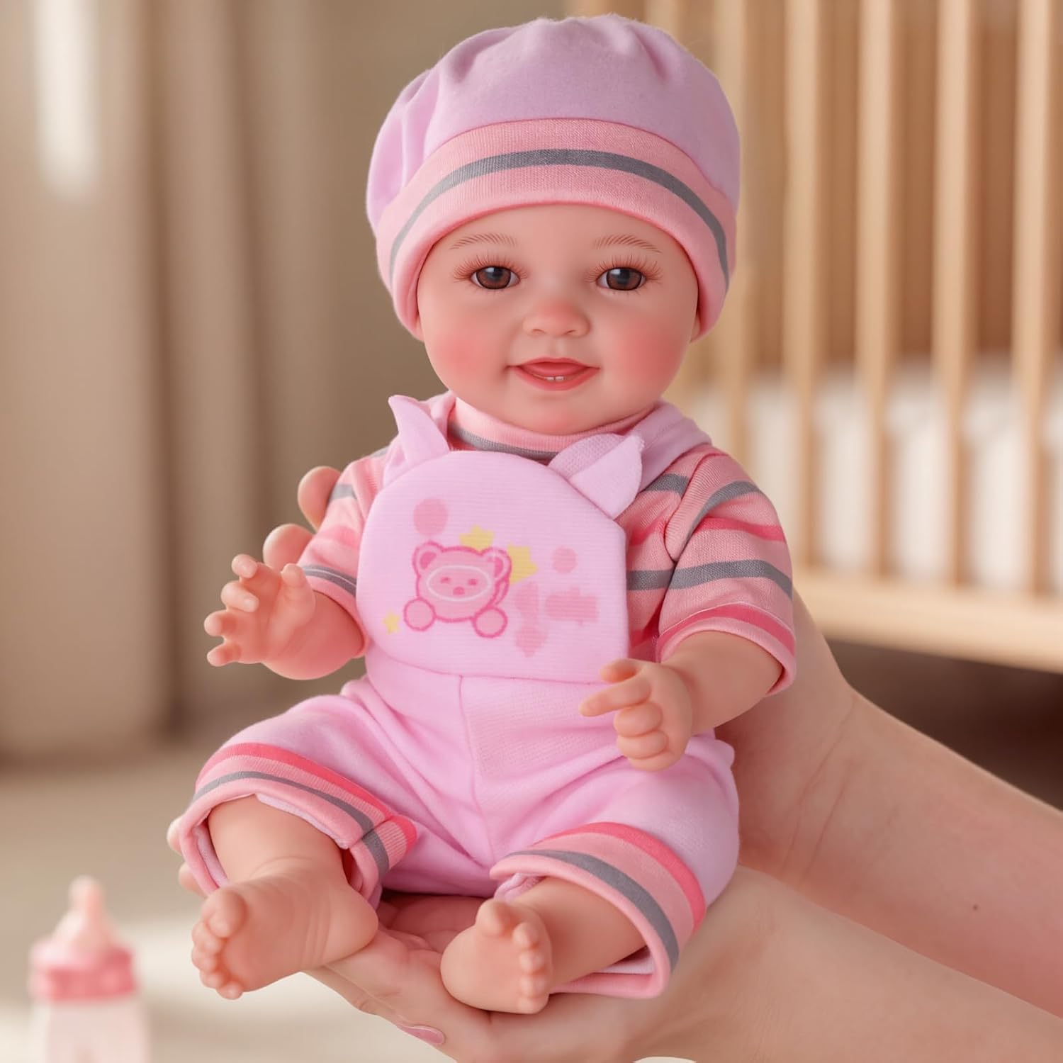 BABESIDE 12 Inch Realistic Baby Doll Girl front view showing lifelike facial features and outfit.