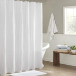 Madison Park Arlo 100% Cotton Shower Curtain front view hanging in a bright modern bathroom setting