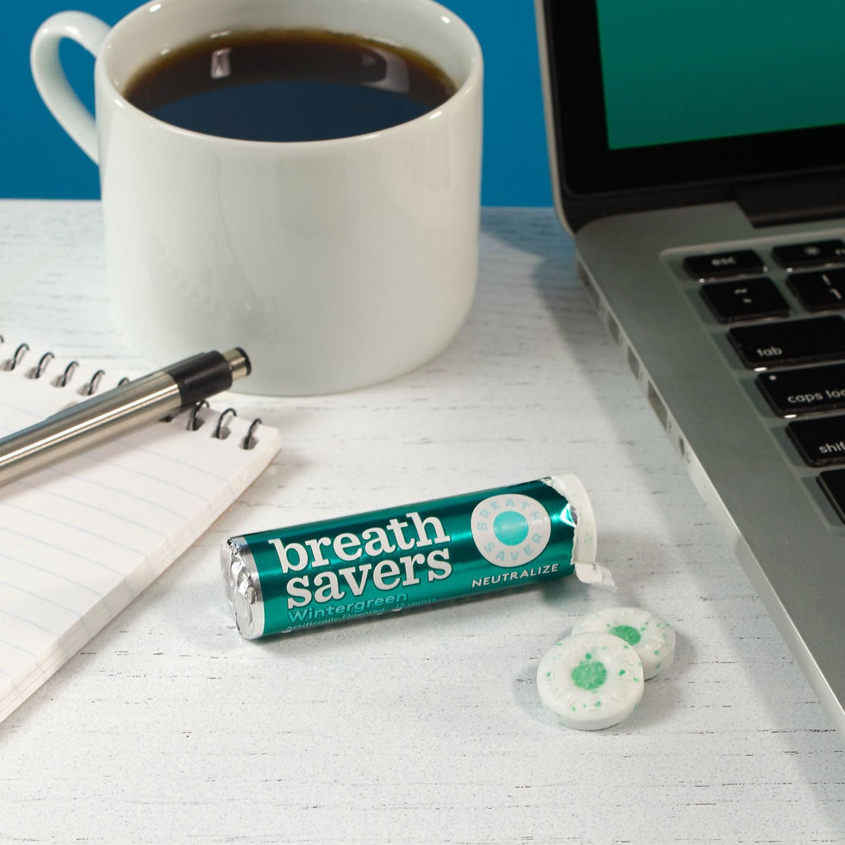 Side view of USA imported Breath Savers mints showing product details.