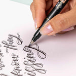 Tombow black ink pen cap removed highlighting synthetic brush tip