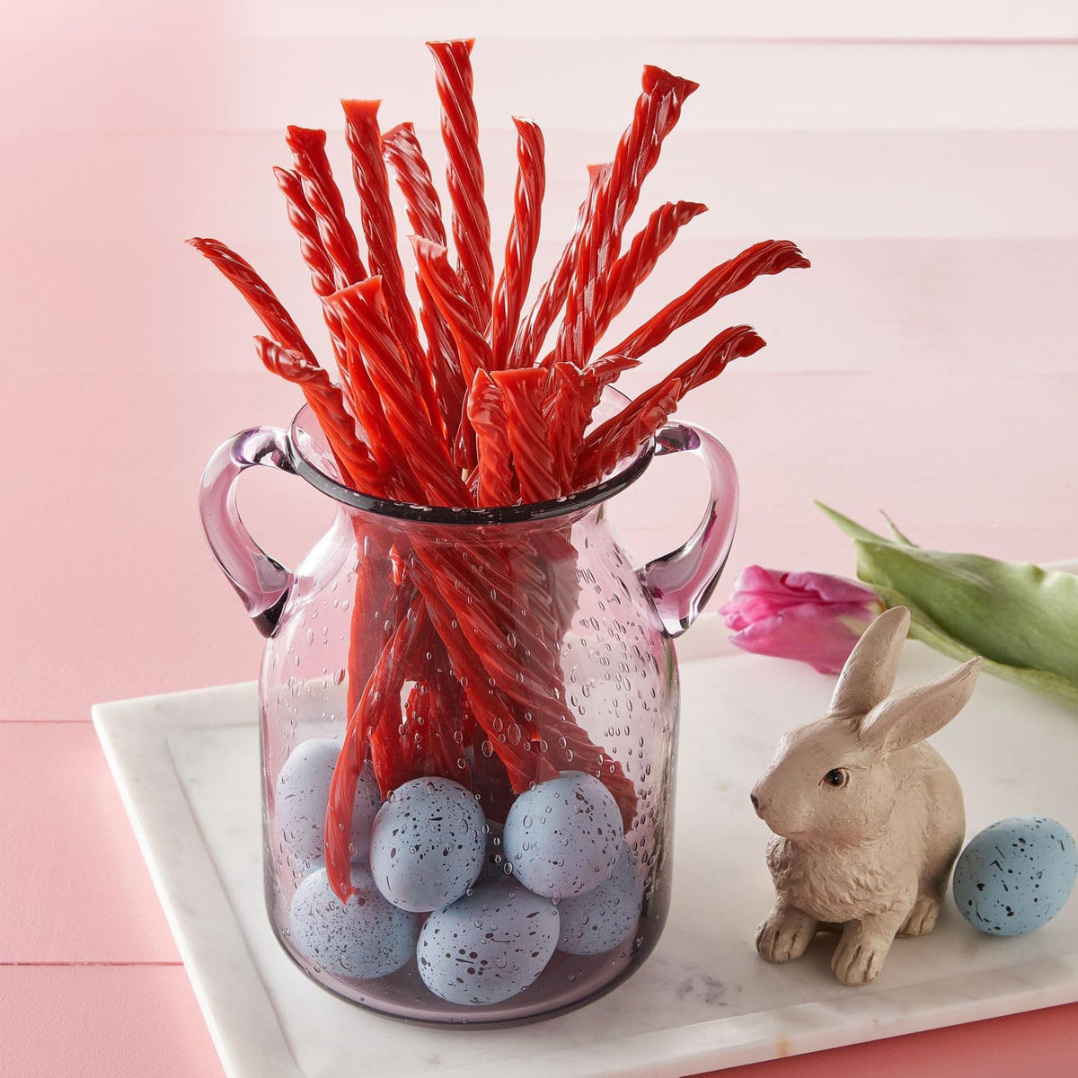Close up shot of chewy strawberry candy twists showing unique texture