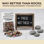 Kimmie Candy chocolate rocks displayed on a decorated themed birthday cake.
