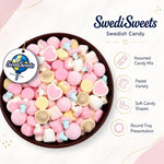 Heart shaped soft marshmallow candy assortment up close detail.