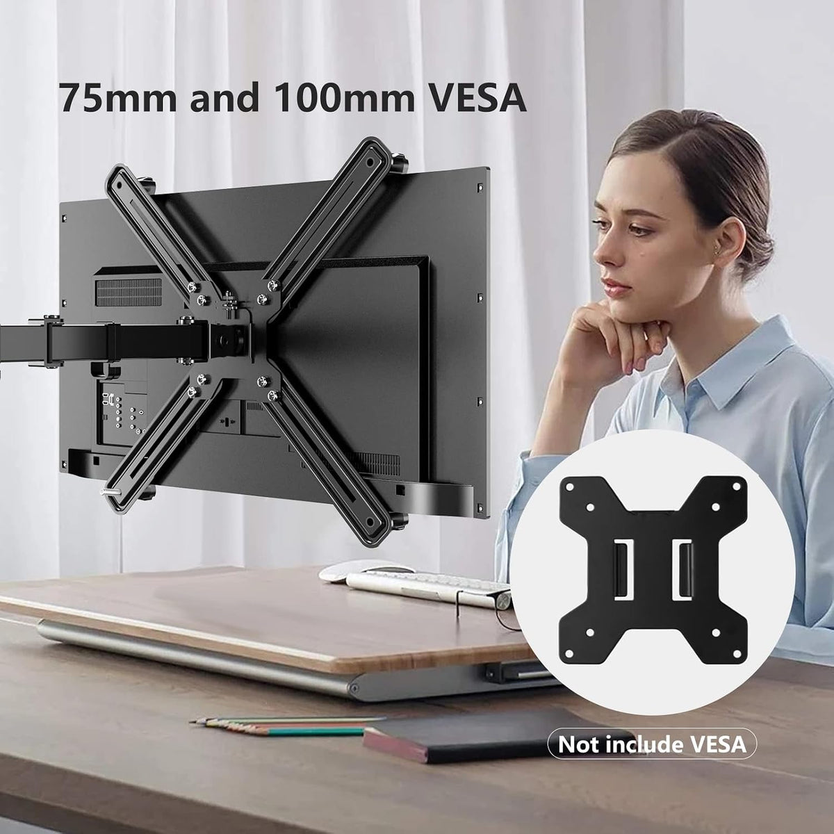 Pholiten mounting kit attached to the back of a flat panel screen