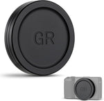 JJC camera lens cap front view showing the sleek matte aluminum alloy exterior shell for compact digital systems.