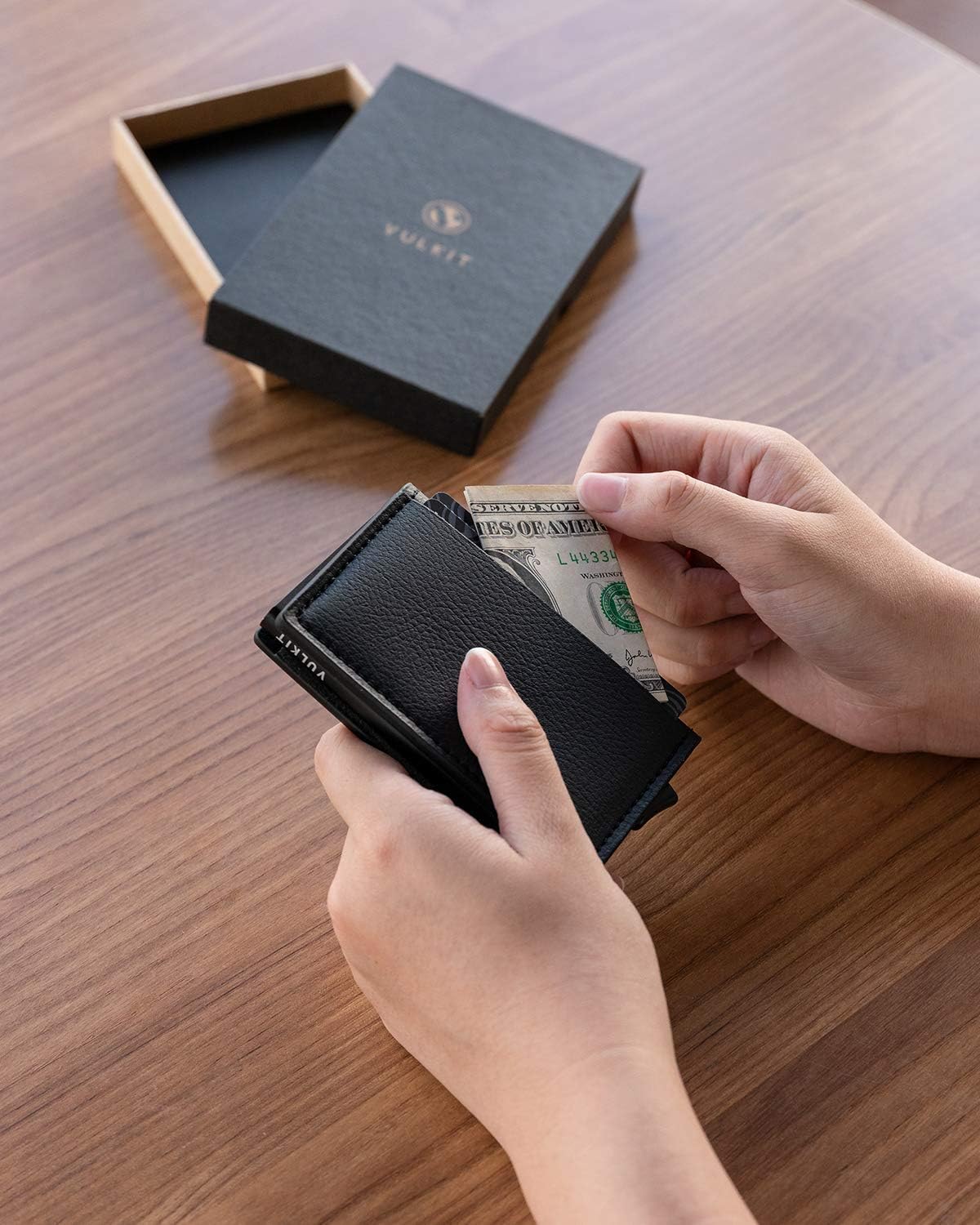 Vulkit RFID blocking wallet angled view showcasing metal and leather texture