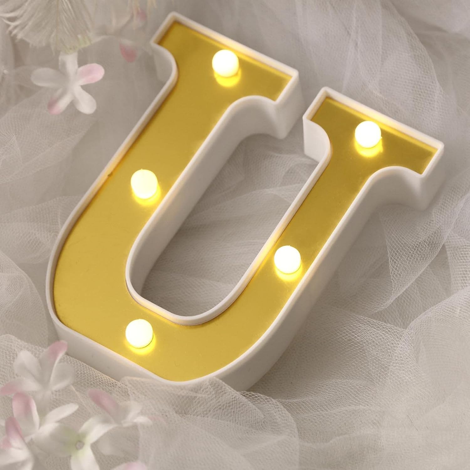 Balsa Circle Tableclothsfactory 6 inch gold marquee letter U front view glowing with warm white LED lights for party decor