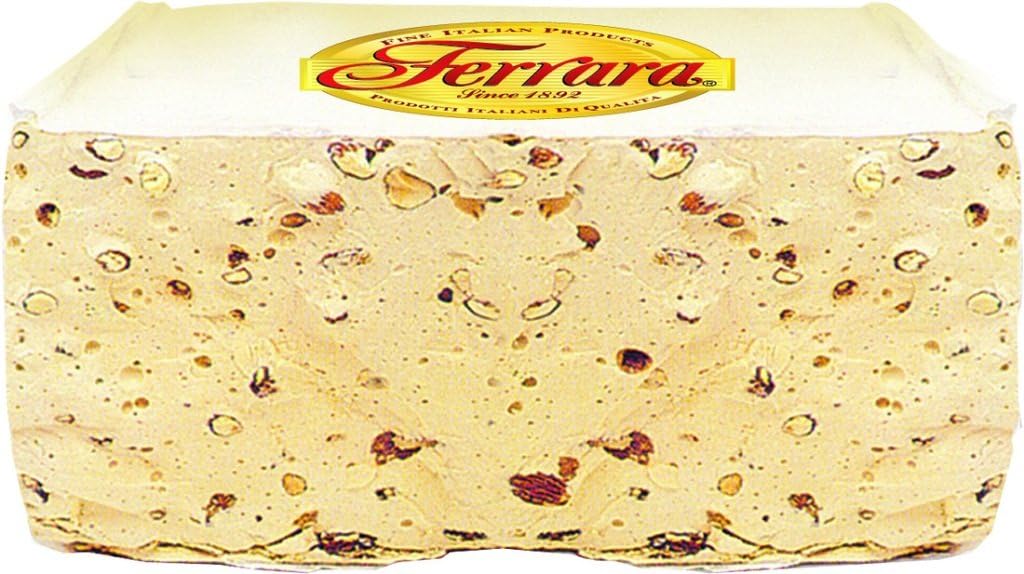 Assorted individually wrapped Italian nougat candies spread out on a table