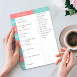 The magnetic backing of the weekly planner pad displayed flat.
