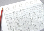 Close up view of alphabet letter cutouts and directional arrows on plastic stencil