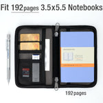 Black journal cover with pen holder and notebook inserted