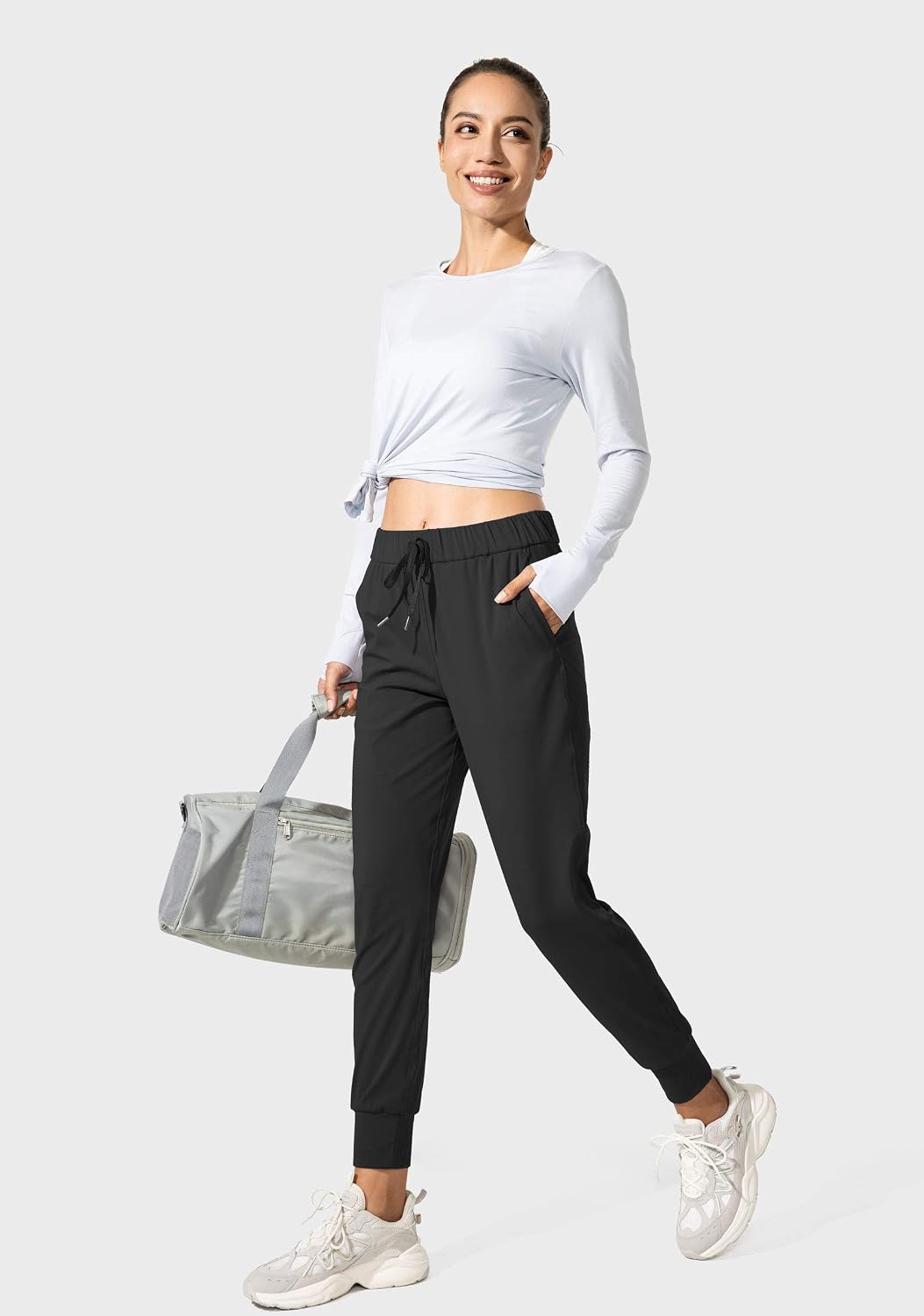 SANTINY Women's Joggers Pants fabric texture and stretch demonstration