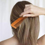 Genrice wooden comb for hair flat lay composition