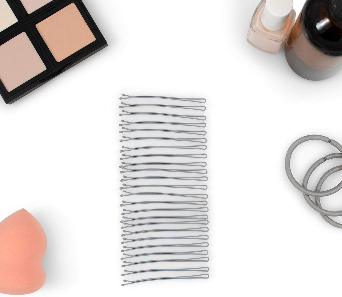 Heliums enamel coated gray bobby pins displayed on surface