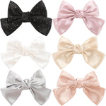 ONEYE large bow hair clips premium collection showcasing six different solid colors.