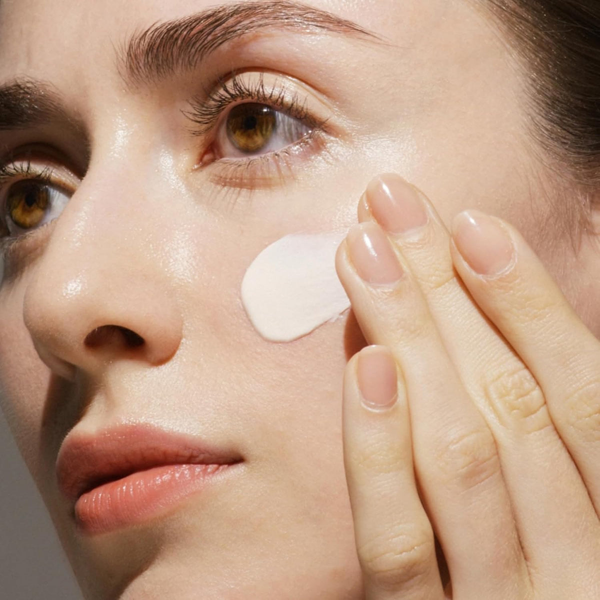 Universal Defense broad spectrum SPF 50 sunscreen application texture close up.