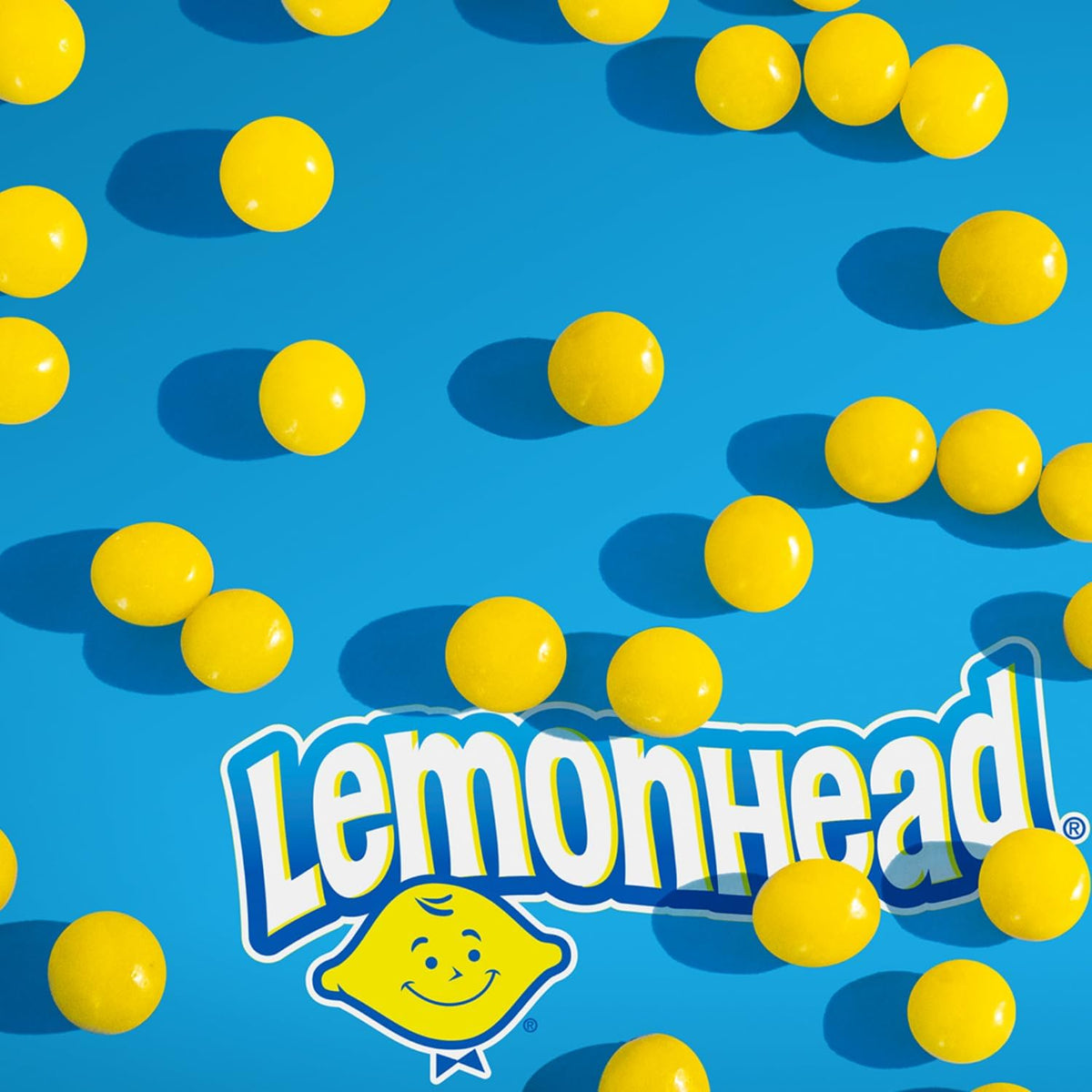 Lemonhead hard candy packaging showing the iconic lemon mascot