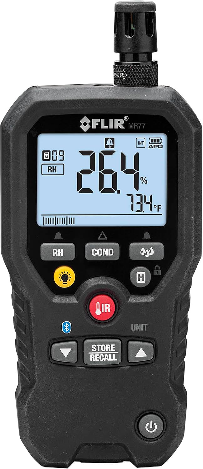 Flir MR60 moisture meter in hand during operation