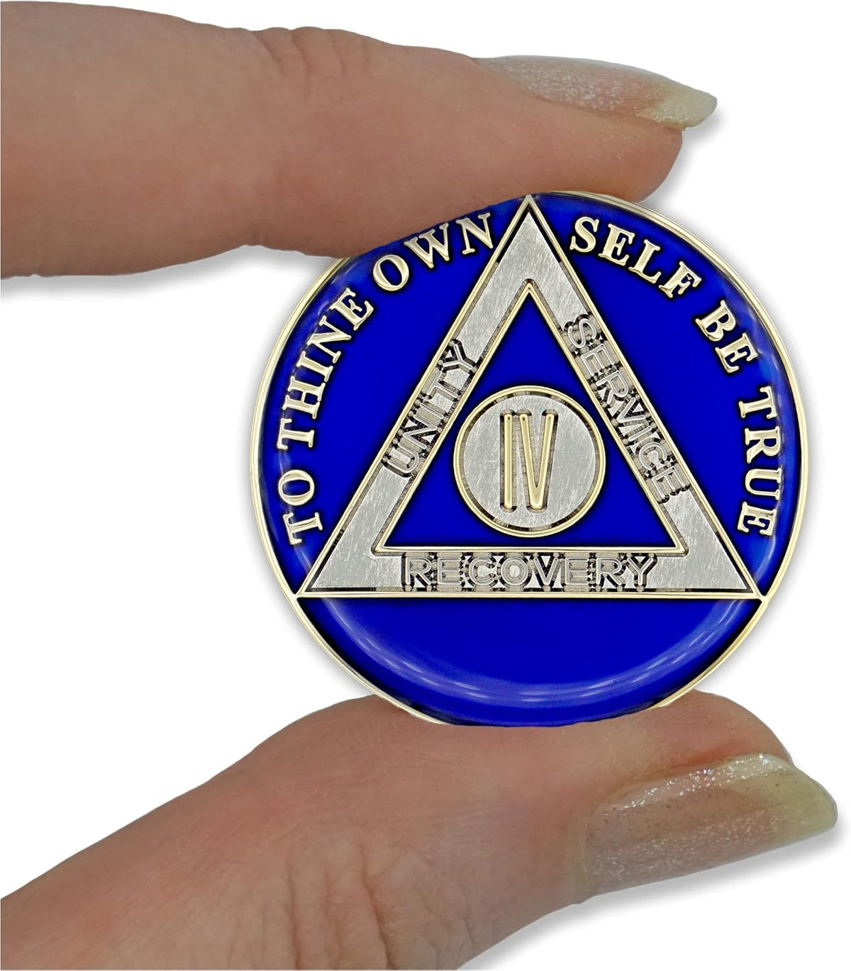 Close up of 24 karat gold and silver plating on sobriety medallion