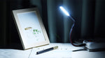 Glovion eye protection USB light plugged into a portable power bank for workspace lighting