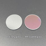 Close up view of anti-reflective coating on glass flashlight lens