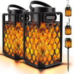 ANERIMST outdoor bluetooth speaker front view showing glowing electronic flickering flame lantern design on outdoor wooden patio deck