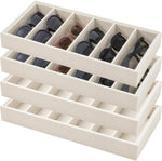 Eyewear display tray holding sunglasses and wristwatches