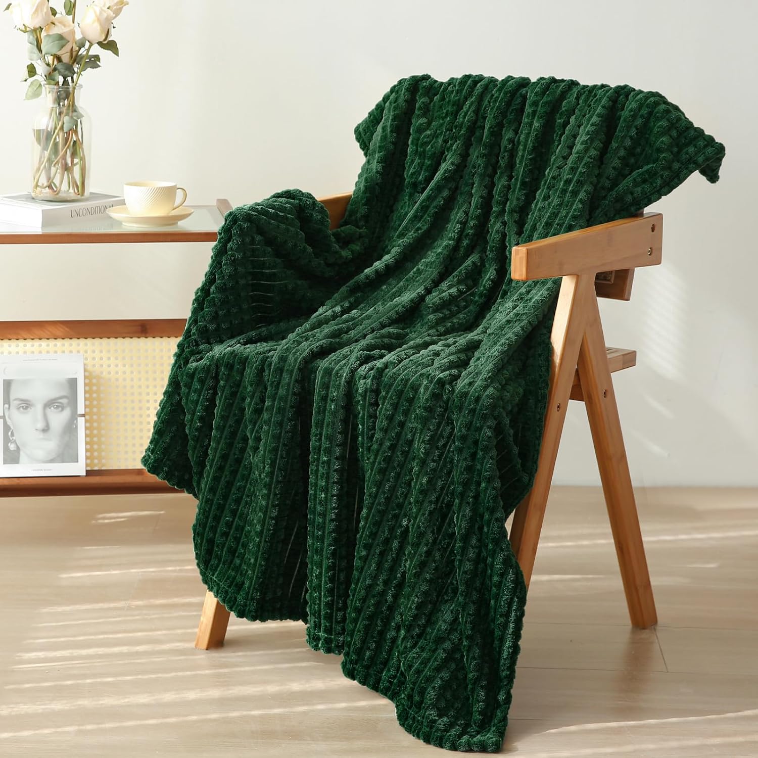 Puncuntex green throw blanket folded on a couch
