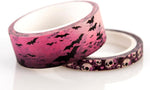 Close up view of 15mm and 5mm washi tape rolls with skull and bat motifs