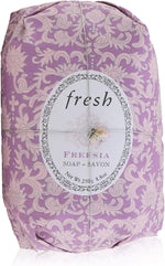 Fresh Freesia hand wrapped soap bar unwrapped showing oval hard milled texture