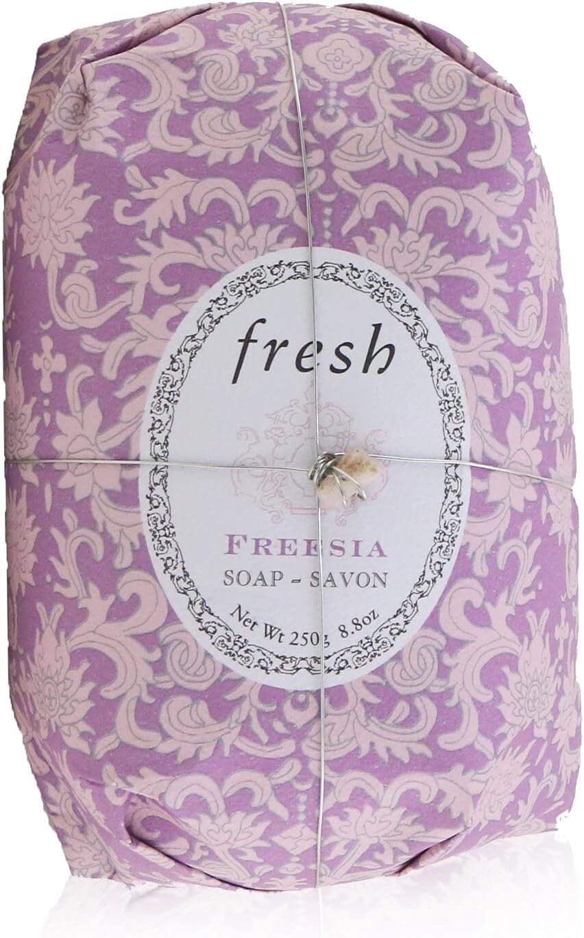 Fresh Freesia hand wrapped soap bar unwrapped showing oval hard milled texture