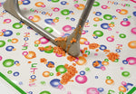 Mommy's Helper high chair mat folded for compact storage