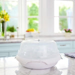 Munchkin bottle sterilizer loaded with baby bottles