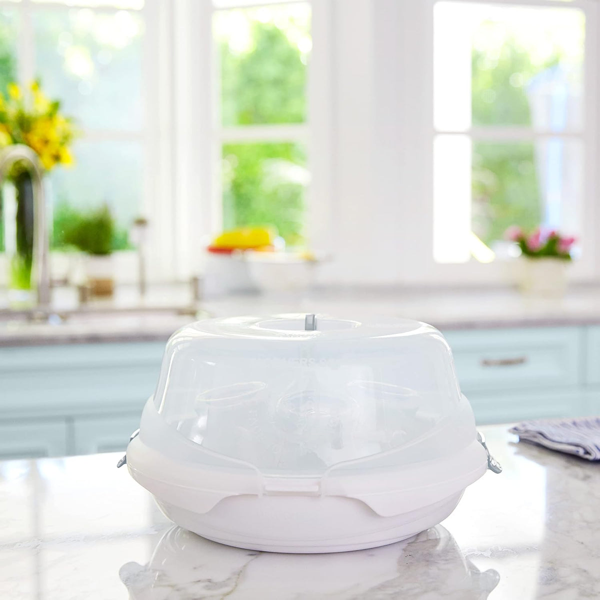 Munchkin bottle sterilizer loaded with baby bottles