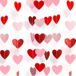 Sincey pre-strung paper heart garland front view hanging against a white wall for anniversary decoration