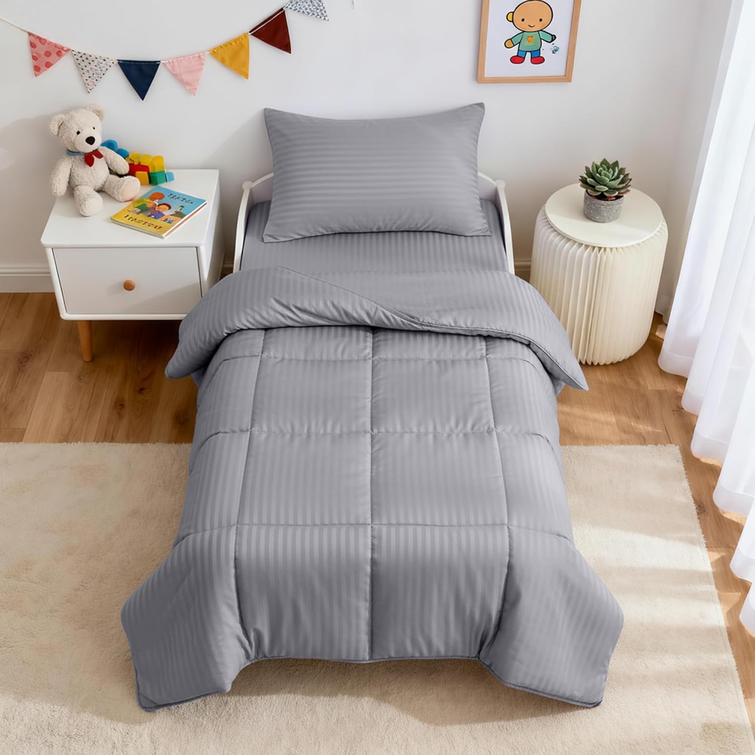 ZPECC Toddler Bedding Set front view of grey stripe comforter and sheets on a crib bed