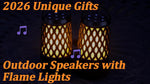MOFOKEAY portable speaker hanging from a tree branch illuminating an outdoor camping site at night.