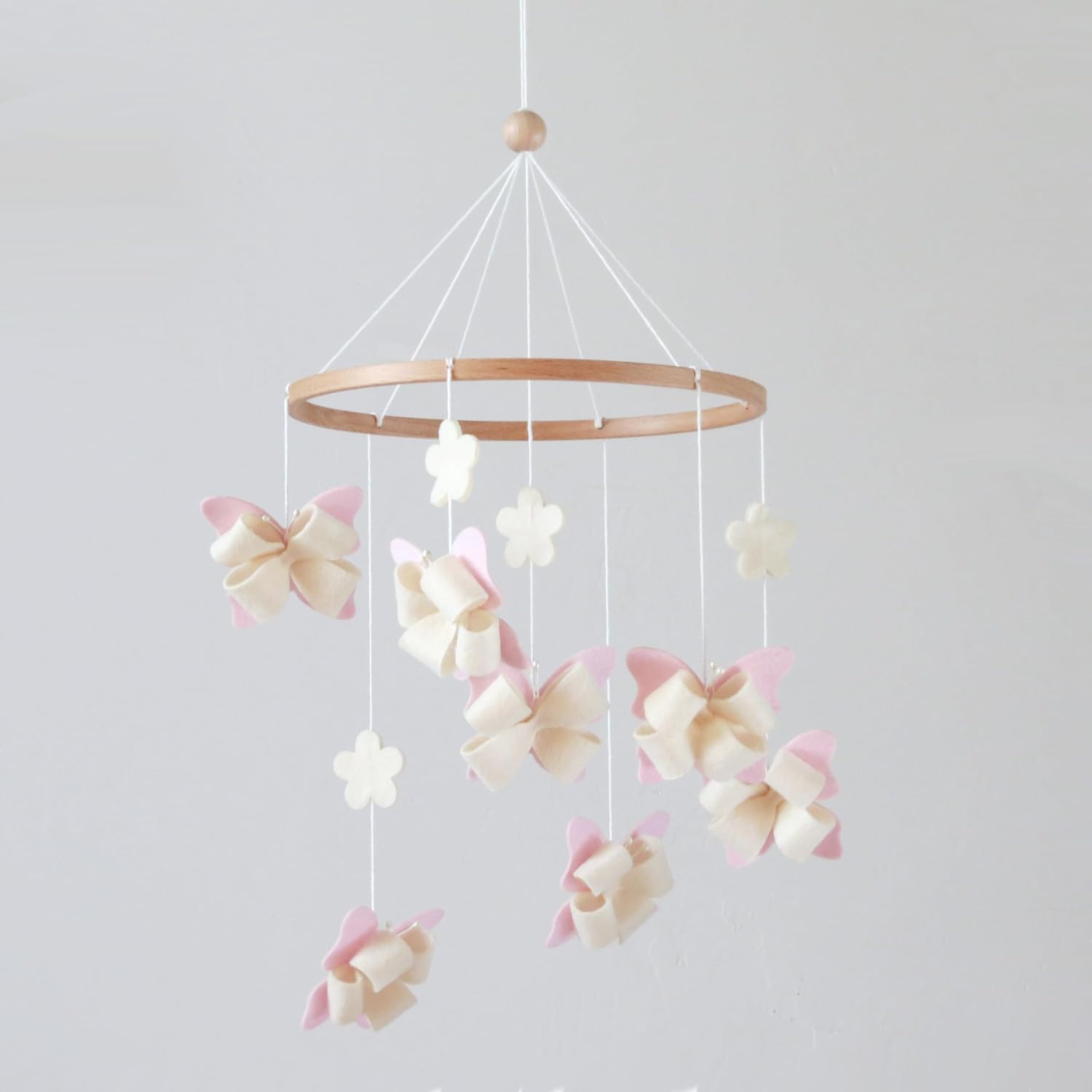 Flora and Ivy butterfly crib mobile front view hanging in a girl nursery.