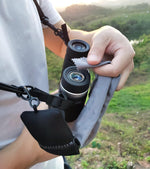 GAIARENA binocular strap attached to optics