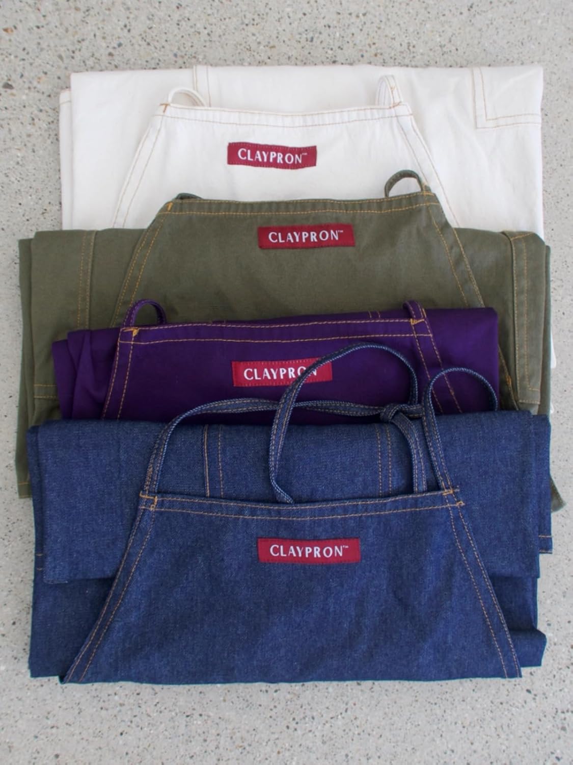 Claypron split leg denim apron folded view