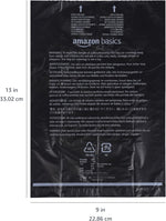 Amazon Basics dog waste bags attached to a pet lead using the secure plastic leash clip.