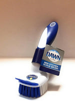 Close-up of Dawn mini brush nylon bristles and built-in dish scraper tip