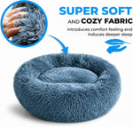 Cat resting inside navy grey plush donut bed