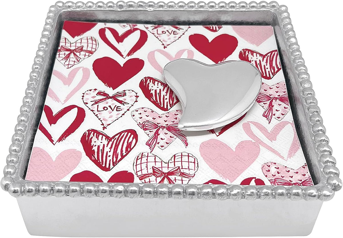 Mariposa silver heart napkin weight angled display on table