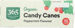 Festive organic candy canes by 365 brand placed on a Christmas tree