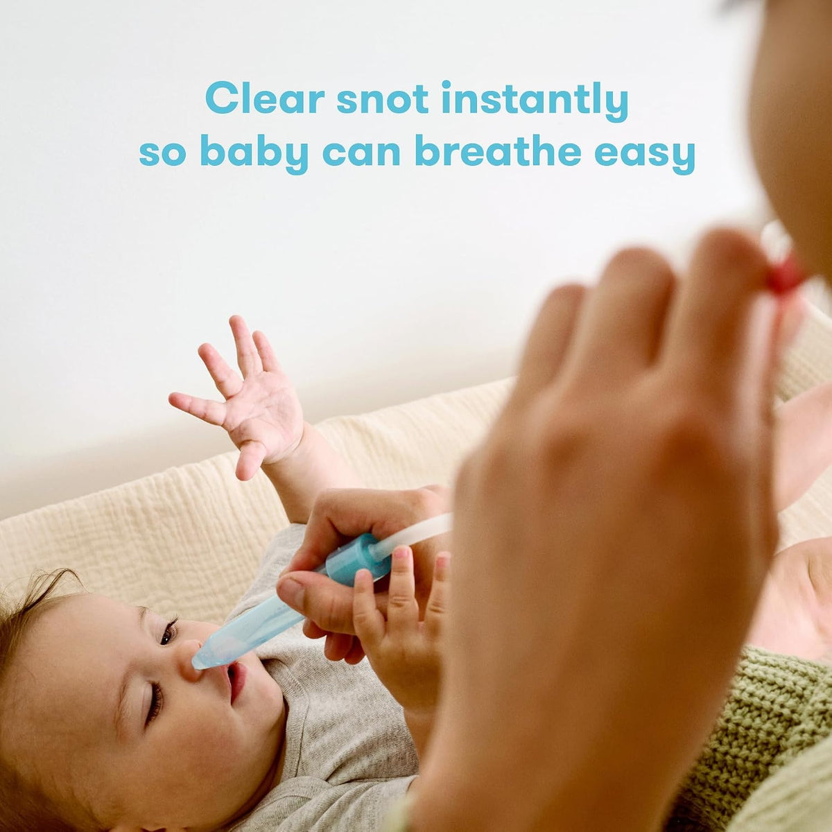 Frida Baby NoseFrida nasal aspirator device close up