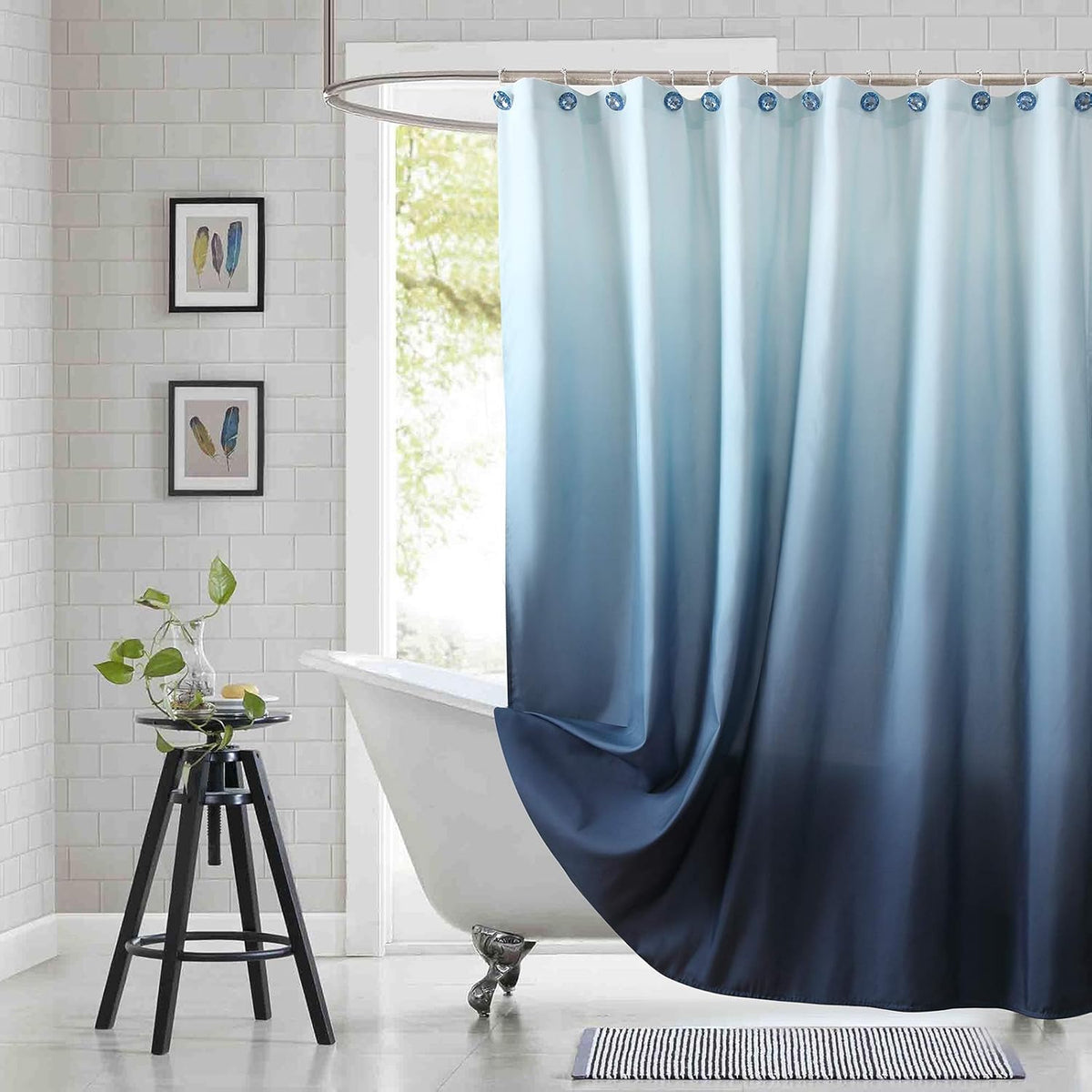 Bestripes ombre fabric shower curtain hanging in a modern bathroom setup showing blue gradient pattern.